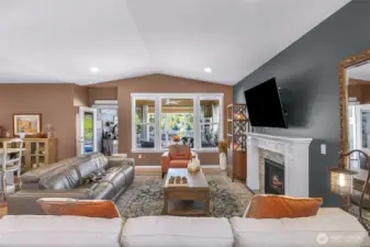 Bright natural light fills this living space while also feel cozy with propane fireplace.