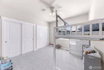 Large second bedroom on main level filled with natural light and large double closets