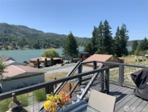 Lake views from the deck and stairway leads down to lower level deck and hot tub area with access to basement ADU