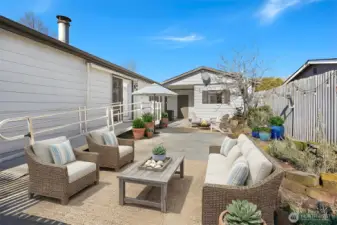 Private back patio and courtyard with southern exposure - virtually staged photo