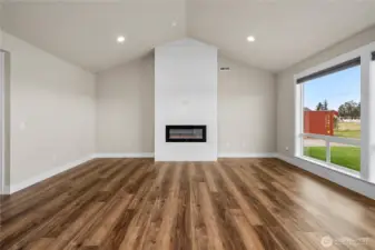 Vaulted Ceilings and Beautiful Fireplace in Living Rm