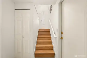 Downstairs houses Laundry Room and  interior garage access.