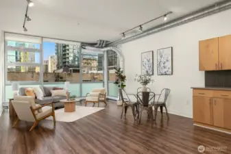 Open floor with towering 13 foot ceilings and west-facing floor-to-ceiling windows the bring in lots of great natural light while keeping the space private and functional