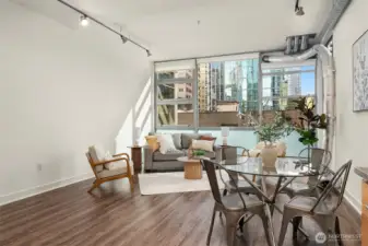 Open floor with towering 13 foot ceilings and west-facing floor-to-ceiling windows the bring in lots of great natural light while keeping the space private and functional