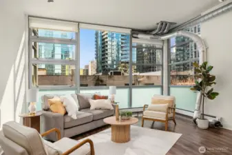 Open floor with towering 13 foot ceilings and west-facing floor-to-ceiling windows the bring in lots of great natural light while keeping the space private and functional