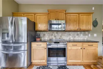 The kitchen was remodeled recently and features SS appliances, granite counters and tons of storage.