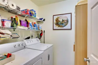 Laundry room with ample storage.
