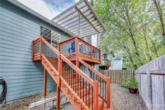 Newer deck and stairs. Covered deck to enjoy the view of the trees and greenspace.