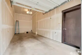 Oversized garage fits two cars and has storage space.