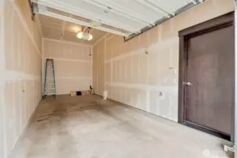 Oversized garage fits two cars and has storage space.