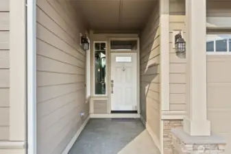 Our Spruce plan has the perfect covered porch entry to greet you and your guests with stone accents panels.