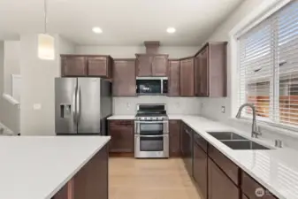 Kitchen features abundance of cabinets for storage of all your kitchen essentials.
