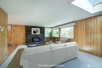The focal point for this main floor living room is a beautiful stone fireplace.