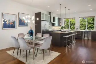Dining room featuring open layout to large kitchen.