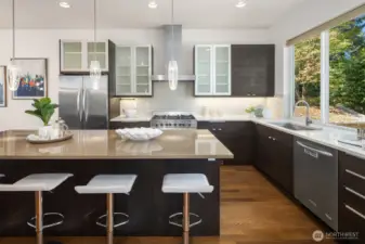 Kitchen featuring ample island seating, soft-close cabinets and 36" Verona range.