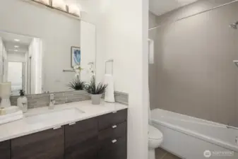 Full bathroom adjacent to bedroom 3.