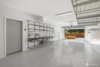 Two-car tandem garage with custom flooring & storage.