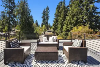 Rooftop deck with city, mountain, & territorial views, perfect for entertaining.