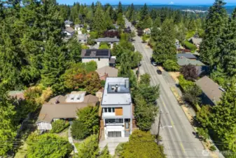 Aerial view of home showcasing rooftop deck.