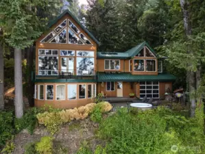 Most living space is on the main level, with loft overlooking great room, and family room on lower level.