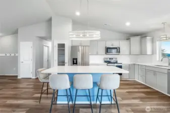 Seating for 4 around the island.