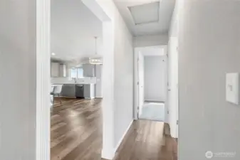 Split plan with two bedrooms on the opposite side of the great room.
