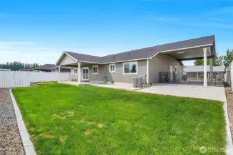 Backyard is fenced and has curbing.