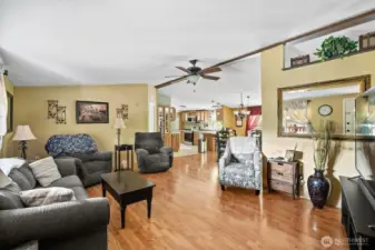 Formal living room looking towards the dining and kitchen.