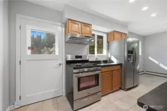 Back door leads to deck. All of the stainless appliances stay with the home making it move-in ready for you!