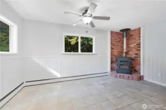 Breakfast area with pellet stove for cozy meals. Or perhaps this can be the game or play room area?
