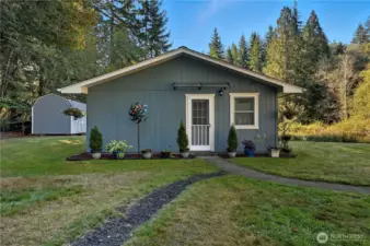 This is the front of the additional dwelling unit, affectionately dubbed "The Little House" by the owner. Notice the garden shed to the left as well.
