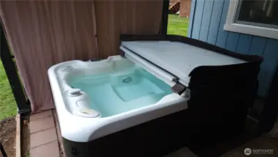 This salt water spa just sparkles, a perfect place to ease those tense muscles after a long day. Spa Tub stays with the home