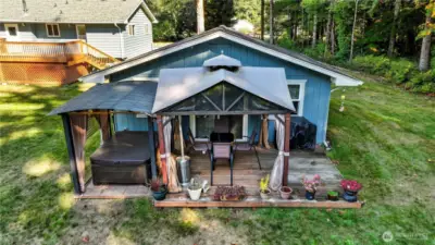 Back of The Little House includes gazebo cover ... AND a sparkling salt water hot tub also under cover at the left.