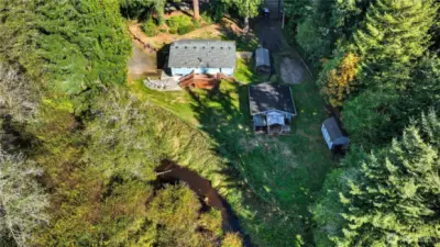 The entire parcel is serene and peaceful. Large enough for all the toys and events. The sellers say listening to the creek and enjoying the birds that visit is one of their favorite pastimes.