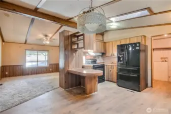 Kitchen, dining and view of family room
