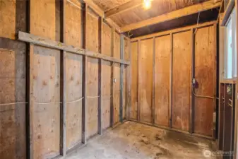 Storage shed behind carport