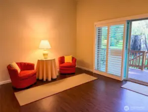 Comfortable living room area of the great room with large sliding glass door to the deck and back yard.