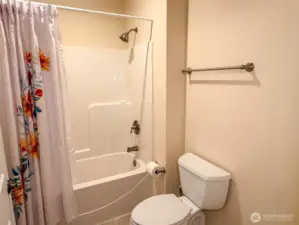 Favorably placed full bath near great room and front entry.