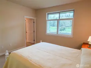 Ensuite 3/4 bath & walk-in closet in primary bedroom.