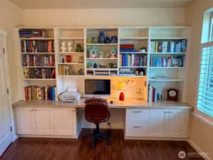 Beautiful built-in shelves and desk in third bedroom that is being used as an office.