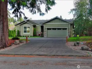Exquisite exposed aggregate concrete driveway & pathway to the front door.