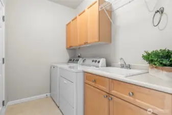 Laundry room with door to garage