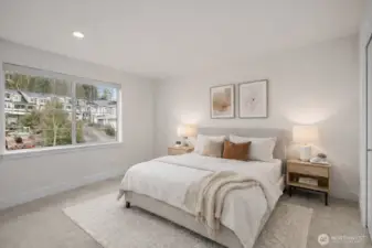 Each bedroom features large windows that fill the space with natural light and overlook the park.