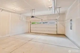 The two-car garage offers ample space for parking and storage, adding everyday convenience.