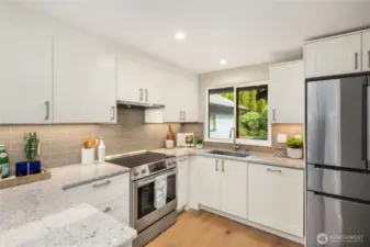 Beautifully updated kitchen with top of the line Bosch stainless steel appliances.