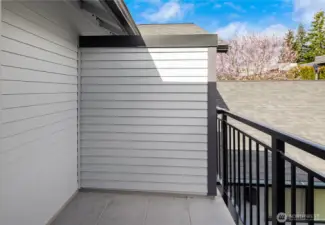 The balcony off the second primary bedroom