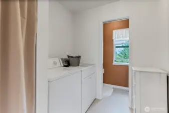 Laundry room just inside from garage entrance