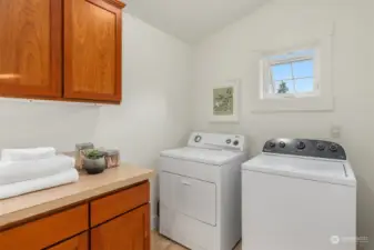 A real Laundry room-not just a closet!  Room to wash, dry, hand and store your clothes and supplies.