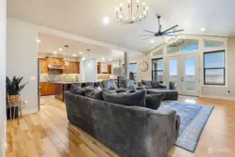 Vaulted ceiling and a wall of windows enhances the great room.