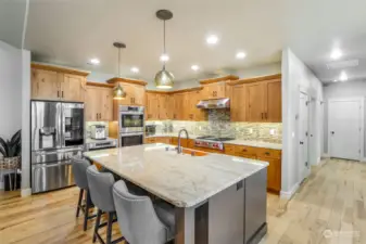 What pleasure to cook in this chef’s kitchen with high end appliances and abundant storage!